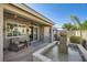 Inviting covered patio with a water feature and outdoor seating area at 7030 Silver Ridge Peak St, Las Vegas, NV 89166