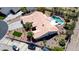 Aerial view of a one-story home featuring a pool, gazebo, desert landscaping, and three-car parking at 7540 Crystal Cave Dr, Las Vegas, NV 89117