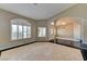 Elegant home foyer featuring high ceilings, marble floors, and arched doorways at 7540 Crystal Cave Dr, Las Vegas, NV 89117
