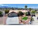 Inviting single-story home offering a three-car garage, desert landscaping, and a concrete driveway at 7540 Crystal Cave Dr, Las Vegas, NV 89117