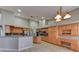 Spacious kitchen with tile floors, granite countertops, and plenty of natural wood cabinets at 7540 Crystal Cave Dr, Las Vegas, NV 89117