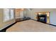 Spacious living room with tile flooring, fireplace, and multiple entrances at 7540 Crystal Cave Dr, Las Vegas, NV 89117