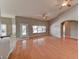 Spacious living area featuring wood floors, ceiling fans, and a backyard entrance at 7540 Crystal Cave Dr, Las Vegas, NV 89117
