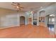 Spacious living room with wood floors, fireplace and built-in bar at 7540 Crystal Cave Dr, Las Vegas, NV 89117