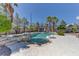 Backyard pool and spa surrounded by lush landscaping and a covered gazebo at 7540 Crystal Cave Dr, Las Vegas, NV 89117