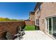 A charming backyard features a patio, artificial grass and mountain views at 8733 Autumn Teal Ave, Las Vegas, NV 89178