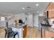 Bright kitchen featuring granite counters, stainless steel appliances, and an adjacent staircase at 8733 Autumn Teal Ave, Las Vegas, NV 89178