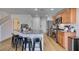 Modern kitchen with granite countertops, stainless steel appliances, and bar stool seating at 8733 Autumn Teal Ave, Las Vegas, NV 89178