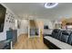 Open-concept living space with wood floors, staircase, and direct access to the kitchen at 8733 Autumn Teal Ave, Las Vegas, NV 89178
