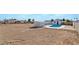 Large backyard featuring a pool, shed, and spacious open area perfect for outdoor activities and entertainment at 934 Lewis Ct, Henderson, NV 89015