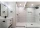Stylish bathroom featuring sleek vanity with modern fixtures and a glass-enclosed shower with marble tile at 934 Lewis Ct, Henderson, NV 89015