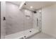 Modern bathroom featuring a glass-enclosed shower with marble tiling and a sleek, minimalist design at 934 Lewis Ct, Henderson, NV 89015
