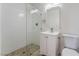 Compact bathroom featuring vanity and glass enclosed shower with tiled floors and walls and minimalist design at 934 Lewis Ct, Henderson, NV 89015