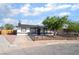 Charming single-story home with a well-maintained lawn and beautiful tree, enhancing its curb appeal at 934 Lewis Ct, Henderson, NV 89015