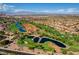 Stunning aerial view showcasing the golf course with lush greenery and serene water features at 9512 Quail Ridge Dr, Las Vegas, NV 89134
