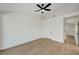 Cozy bedroom with hardwood floors, neutral paint, and an en suite bathroom at 9512 Quail Ridge Dr, Las Vegas, NV 89134
