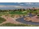 Beautiful golf course with lush fairways and sand traps on a sunny day at 9512 Quail Ridge Dr, Las Vegas, NV 89134
