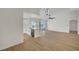 Open floor plan with hardwood floors and sliding glass doors to backyard at 9512 Quail Ridge Dr, Las Vegas, NV 89134