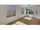 Bright living room with ample windows providing plenty of natural light and wood floors at 9512 Quail Ridge Dr, Las Vegas, NV 89134