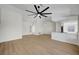 Spacious living room with hardwood floors and an open floor plan connecting to the kitchen at 9512 Quail Ridge Dr, Las Vegas, NV 89134