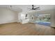 Spacious living room with hardwood floors and an open floor plan connecting to the kitchen at 9512 Quail Ridge Dr, Las Vegas, NV 89134