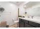 Bathroom with white walls, dark cabinetry, and a white countertop with a sink at 965 Nevada State Dr # 15104, Henderson, NV 89002