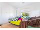 Comfortable bedroom with a bright window, light carpet, and a glimpse of the outdoors at 965 Nevada State Dr # 15104, Henderson, NV 89002