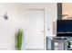 Modern white door with five panels complemented by the interior's clean, minimalist design at 965 Nevada State Dr # 15104, Henderson, NV 89002