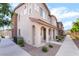 Exterior view of a home with neutral colors, a tiled roof, and easy access to a sidewalk at 965 Nevada State Dr # 15104, Henderson, NV 89002