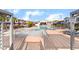 Community pool with lounge chairs, umbrellas, and lush landscaping, creating a relaxing oasis at 965 Nevada State Dr # 15104, Henderson, NV 89002