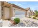 Inviting single-story home with a private entrance, attached two-car garage, and lush landscaping at 9688 Meeks Bay Ave, Las Vegas, NV 89148