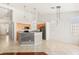 Open kitchen boasts stainless steel appliances, granite countertops, and modern pendant lighting at 9688 Meeks Bay Ave, Las Vegas, NV 89148