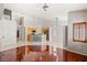 Open floor plan featuring a kitchen with wooden cabinetry, tile floors, and island seating at 9688 Meeks Bay Ave, Las Vegas, NV 89148