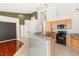 Kitchen features stainless steel appliances, light wood cabinets, and breakfast bar at 9688 Meeks Bay Ave, Las Vegas, NV 89148