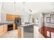 Featuring stainless steel appliances, gray tiled breakfast bar, and lots of natural light at 9688 Meeks Bay Ave, Las Vegas, NV 89148