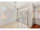 Bright living room with many windows and tile flooring at 9688 Meeks Bay Ave, Las Vegas, NV 89148
