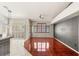 Spacious living room featuring tile and wood flooring, bright windows, and neutral color palette at 9688 Meeks Bay Ave, Las Vegas, NV 89148
