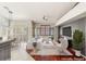 Open-concept living room with neutral tones, modern furniture, and stylish decor elements at 9688 Meeks Bay Ave, Las Vegas, NV 89148