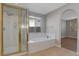 Bright bathroom featuring a separate shower and tub at 981 Buffalo River Ave, Henderson, NV 89002