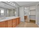 Bright bathroom featuring double sinks, shower and a large mirror at 981 Buffalo River Ave, Henderson, NV 89002