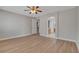 A spacious bedroom featuring neutral walls and wood-look flooring at 981 Buffalo River Ave, Henderson, NV 89002