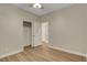 Bedroom with wood floors, neutral walls, closet, and doorway at 981 Buffalo River Ave, Henderson, NV 89002