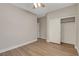 Cozy bedroom featuring a ceiling fan, neutral walls, and a closet with sliding doors at 981 Buffalo River Ave, Henderson, NV 89002