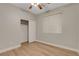 Bedroom featuring wood-look flooring, a window, closet and a ceiling fan at 981 Buffalo River Ave, Henderson, NV 89002