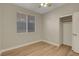 Bedroom with a window, wood floors, neutral walls, and a closet at 981 Buffalo River Ave, Henderson, NV 89002