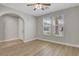 Neutral bedroom with a ceiling fan, light hardwood floors and windows to let in natural light at 981 Buffalo River Ave, Henderson, NV 89002