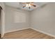 Bright bedroom featuring wood-look flooring, a window and a ceiling fan at 981 Buffalo River Ave, Henderson, NV 89002