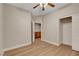 Bedroom with hardwood floors, ceiling fan, and closet plus ensuite at 981 Buffalo River Ave, Henderson, NV 89002