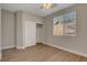 Bright bedroom with wood floors, a window with blinds, and a closet at 981 Buffalo River Ave, Henderson, NV 89002