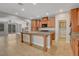Open kitchen featuring tile floors, wood cabinets, and granite countertops at 981 Buffalo River Ave, Henderson, NV 89002